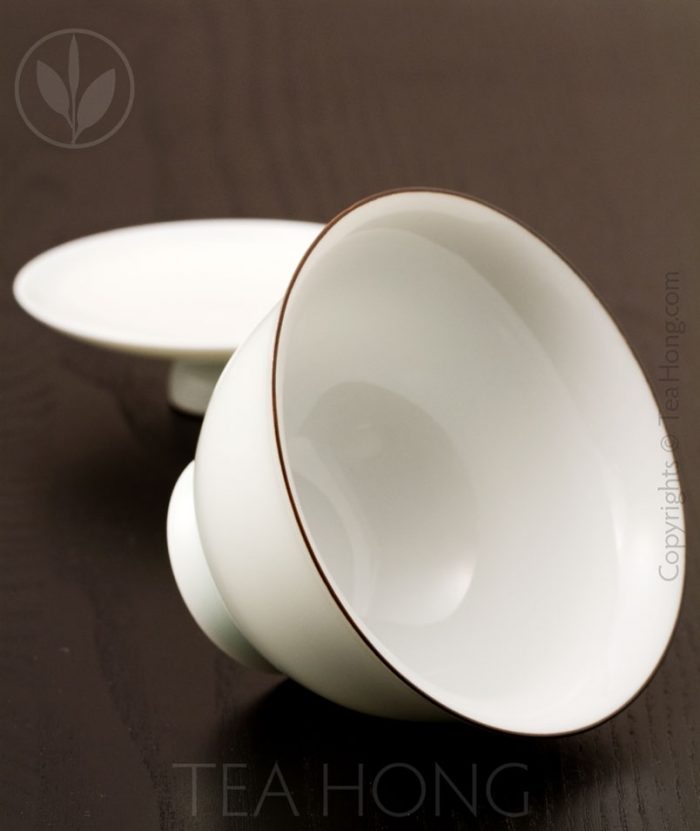 The interior of the gaiwan is also protected with a thick overglaze but reveals the natural white of the kaolin porcelain