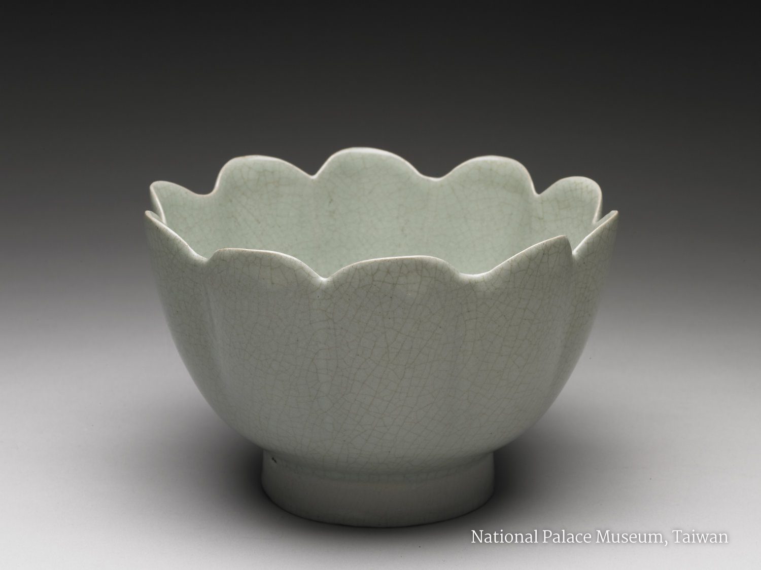 A Song Dynasty Ru Ware wine warming bowl showing the typical cracked surface glaze effect