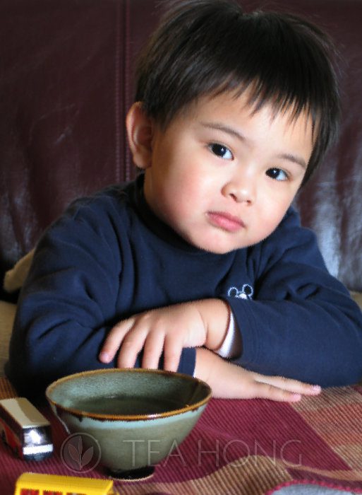 Portrait of Paul at three, with a tea bowl